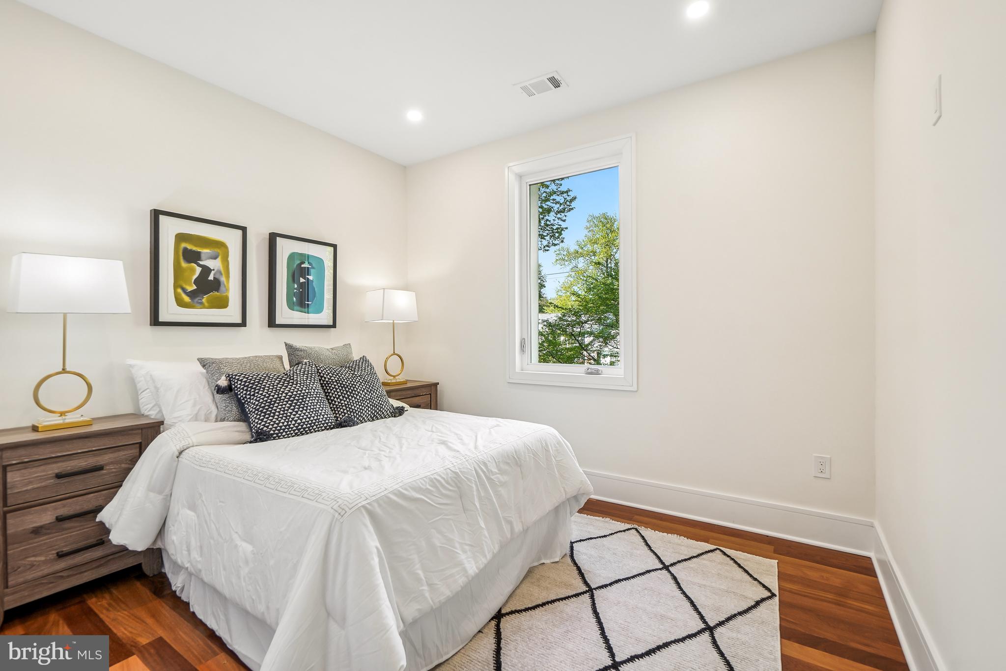 7301 Marbury Road Bethesda, MD 20817 - Photo 50 of 81 a bedroom with a bed and a painting on the wall