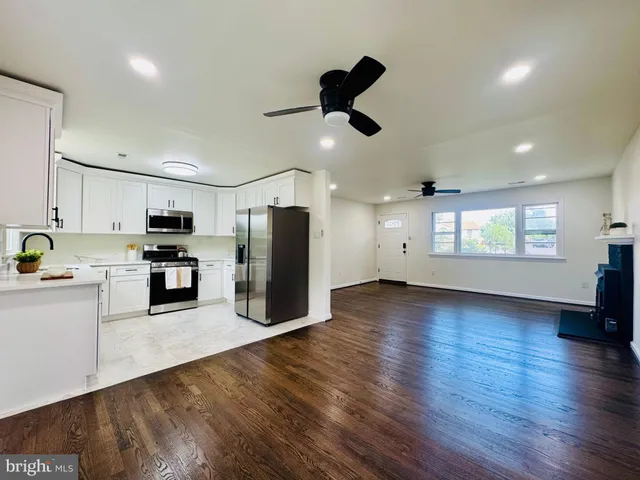 a kitchen with granite countertop cabinets and steel stainless steel appliances