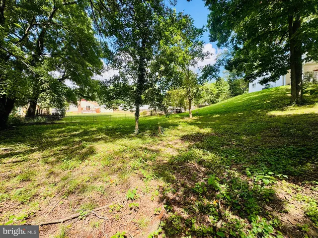 an aerial view of a golf course with swimming pool