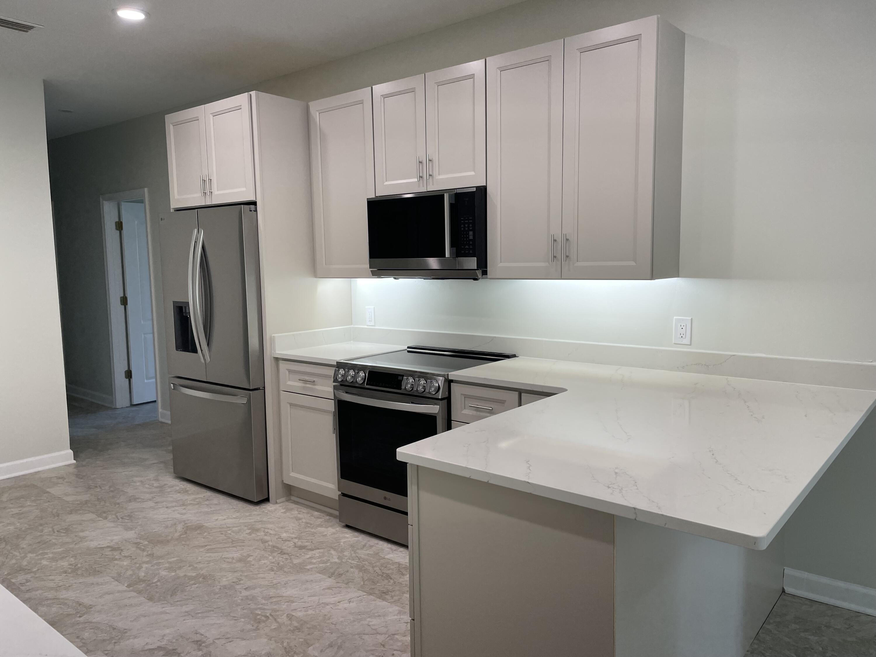 3 Walton Way Miramar Beach, FL 32550 - Photo 12 of 35 a kitchen with a refrigerator stove and microwave