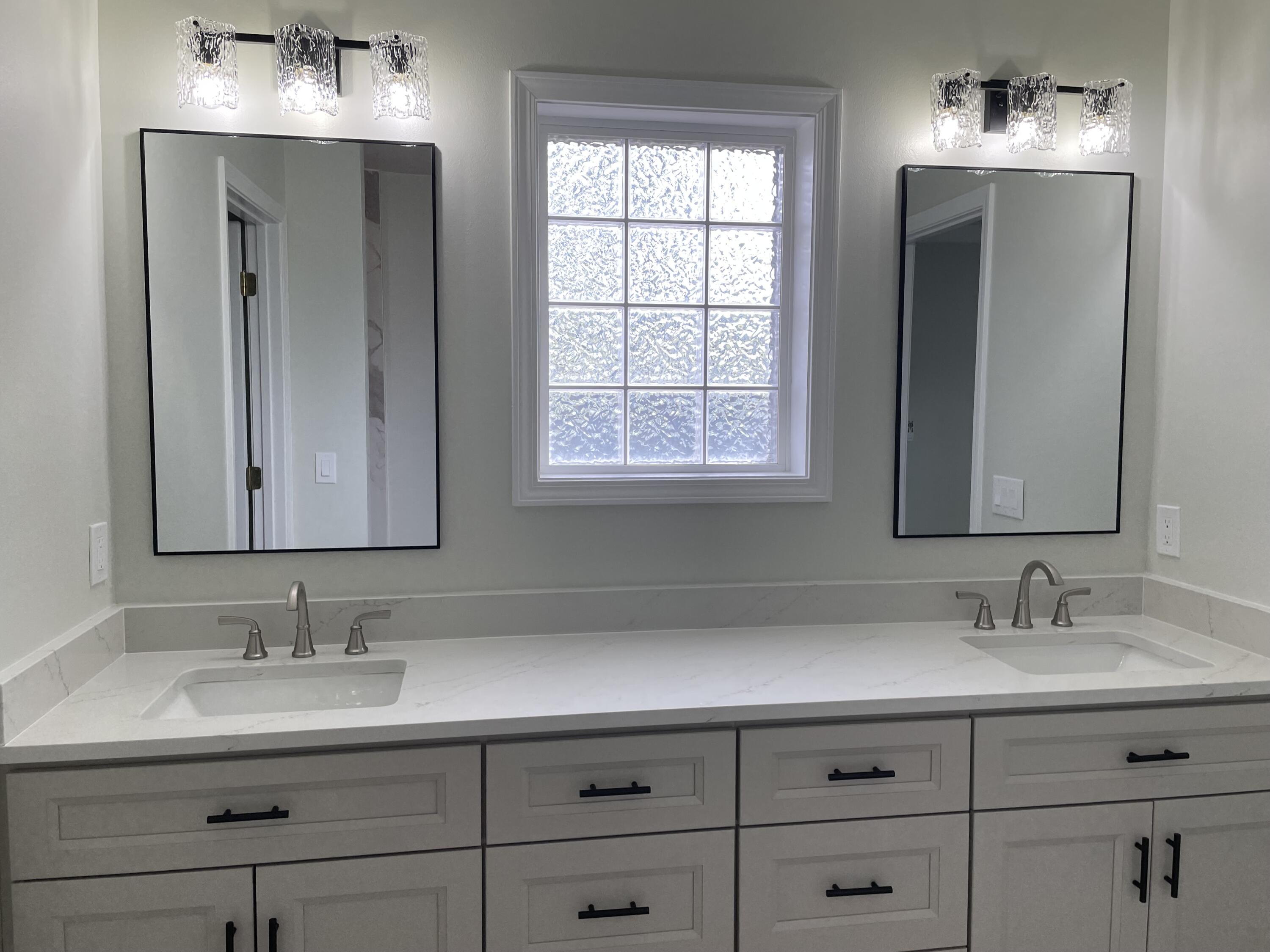 3 Walton Way Miramar Beach, FL 32550 - Photo 15 of 35 a bathroom with double sink and a mirror