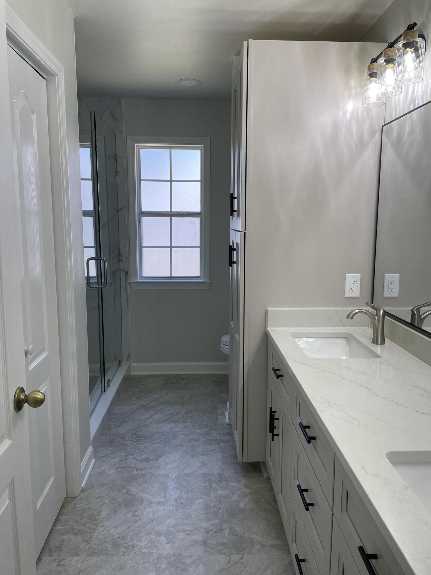 3 Walton Way Miramar Beach, FL 32550 - Photo 27 of 35 a bathroom with a granite countertop sink a mirror and a shower