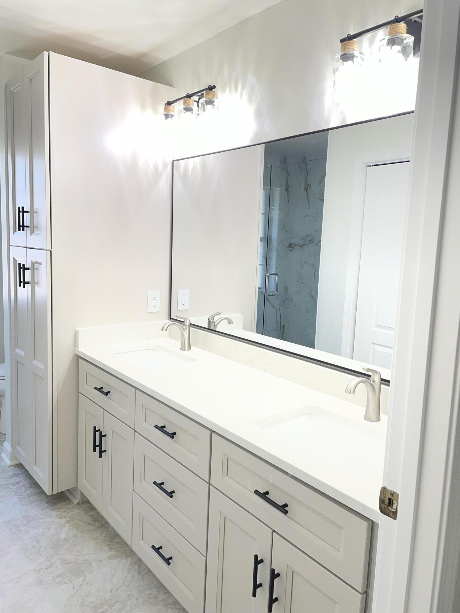 3 Walton Way Miramar Beach, FL 32550 - Photo 28 of 35 a bathroom with a double vanity sink and mirror