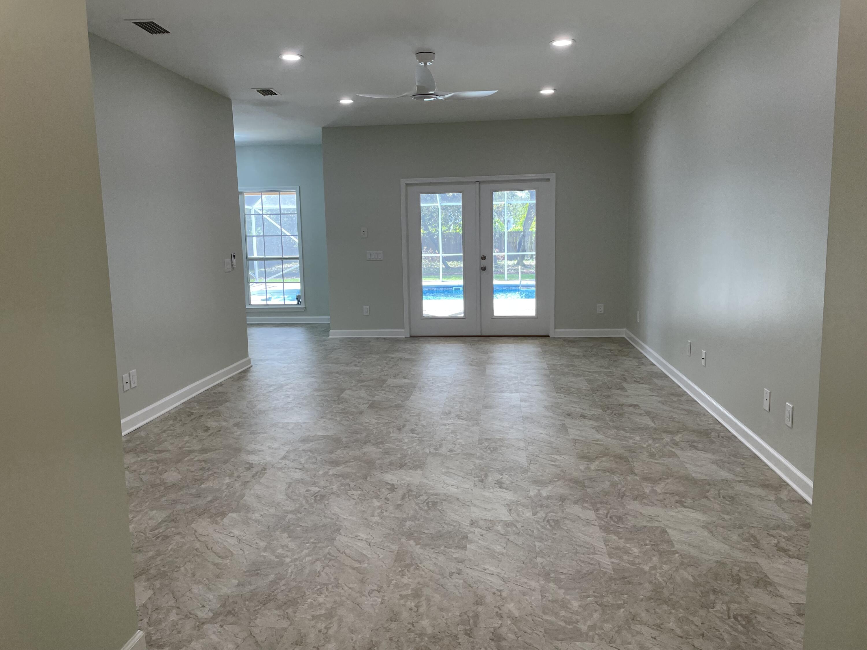 3 Walton Way Miramar Beach, FL 32550 - Photo 3 of 35 an empty room with wooden floor and windows