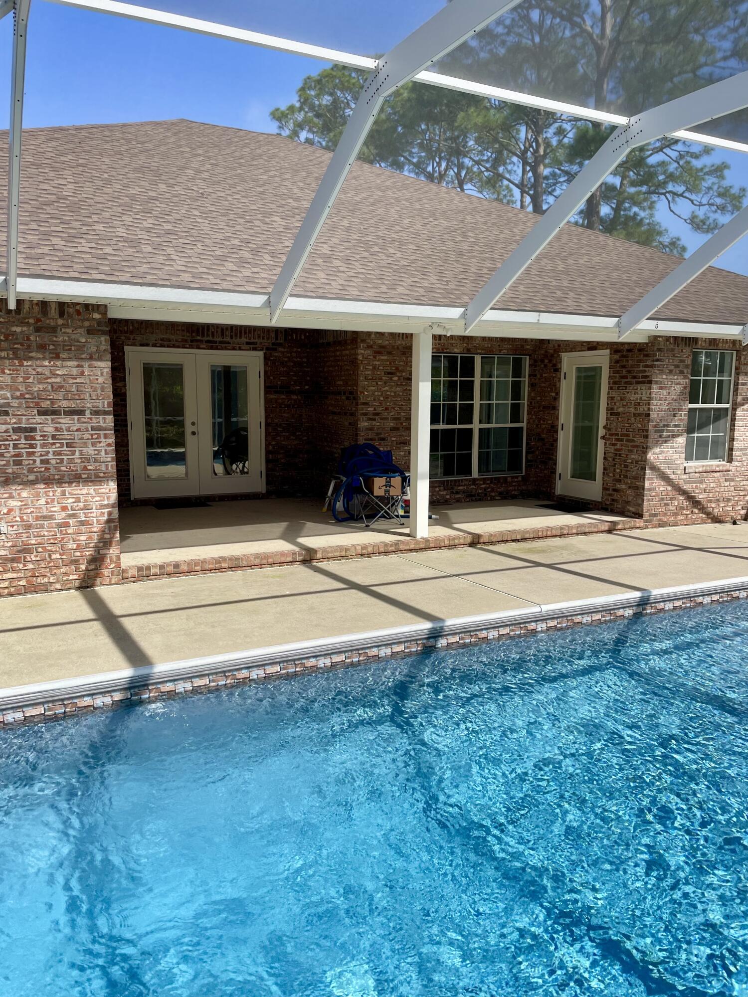 3 Walton Way Miramar Beach, FL 32550 - Photo 32 of 35 a front view of a house with a yard and potted plants
