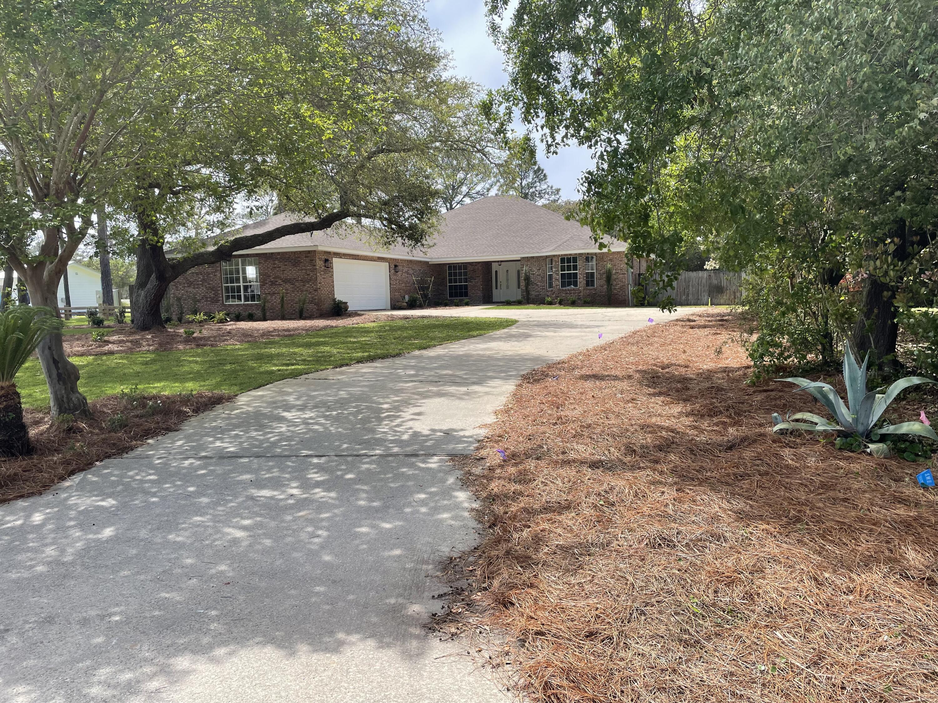3 Walton Way Miramar Beach, FL 32550 - Photo 35 of 35 a front view of a house with a yard and trees
