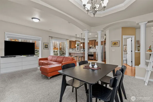 a view of a dining room with furniture window and wooden floor