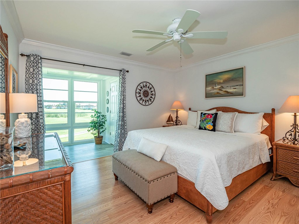 20 Pine Arbor Lane, Unit 202 Vero Beach, FL 32962 - Photo 15 of 36 a bedroom with a large bed and a couch