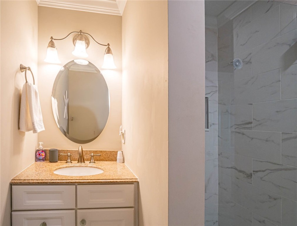 20 Pine Arbor Lane, Unit 202 Vero Beach, FL 32962 - Photo 17 of 36 a bathroom with a sink and a mirror