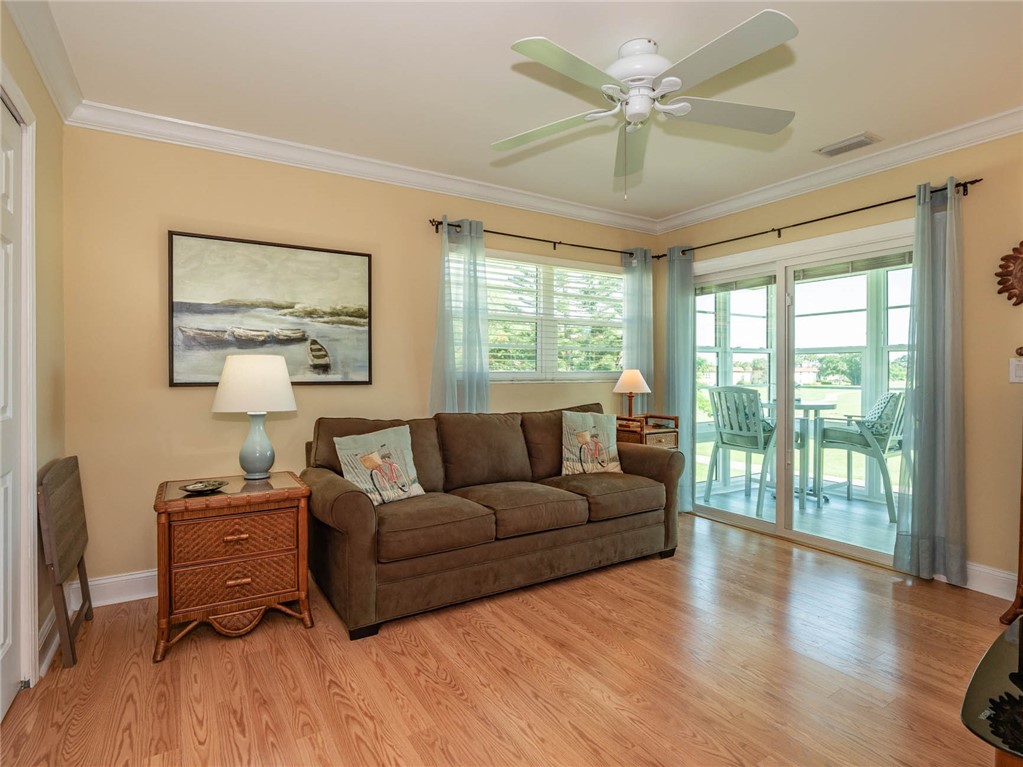 20 Pine Arbor Lane, Unit 202 Vero Beach, FL 32962 - Photo 22 of 36 a living room with furniture and a window