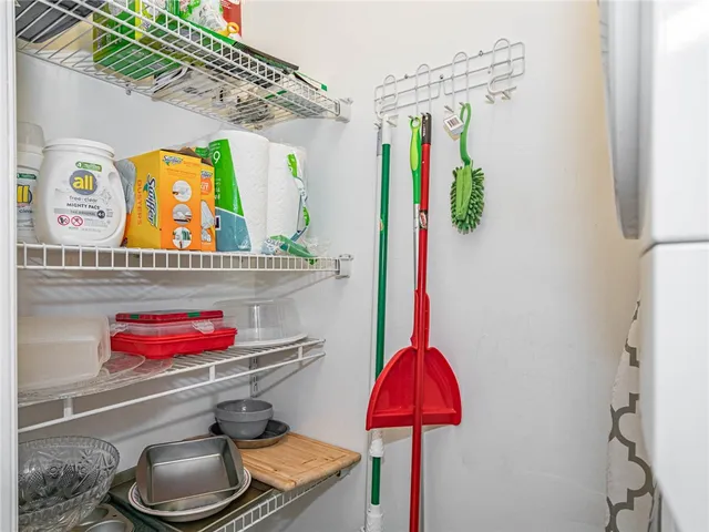 a living room filled with furniture and a large window