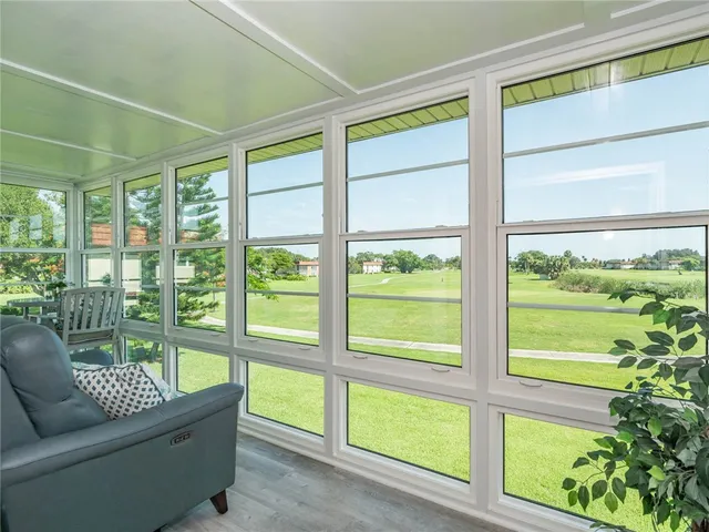 a view of a room with furniture and a window