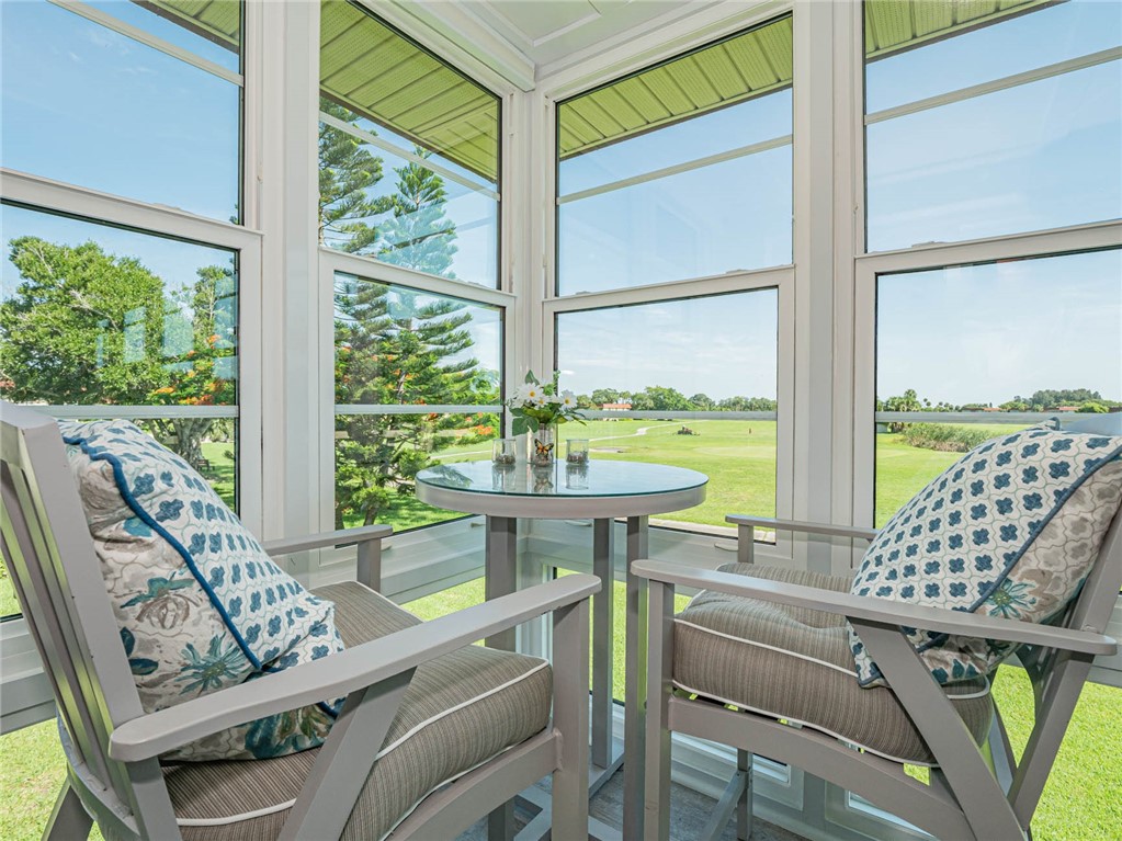 20 Pine Arbor Lane, Unit 202 Vero Beach, FL 32962 - Photo 29 of 36 a view of a room with furniture and a window