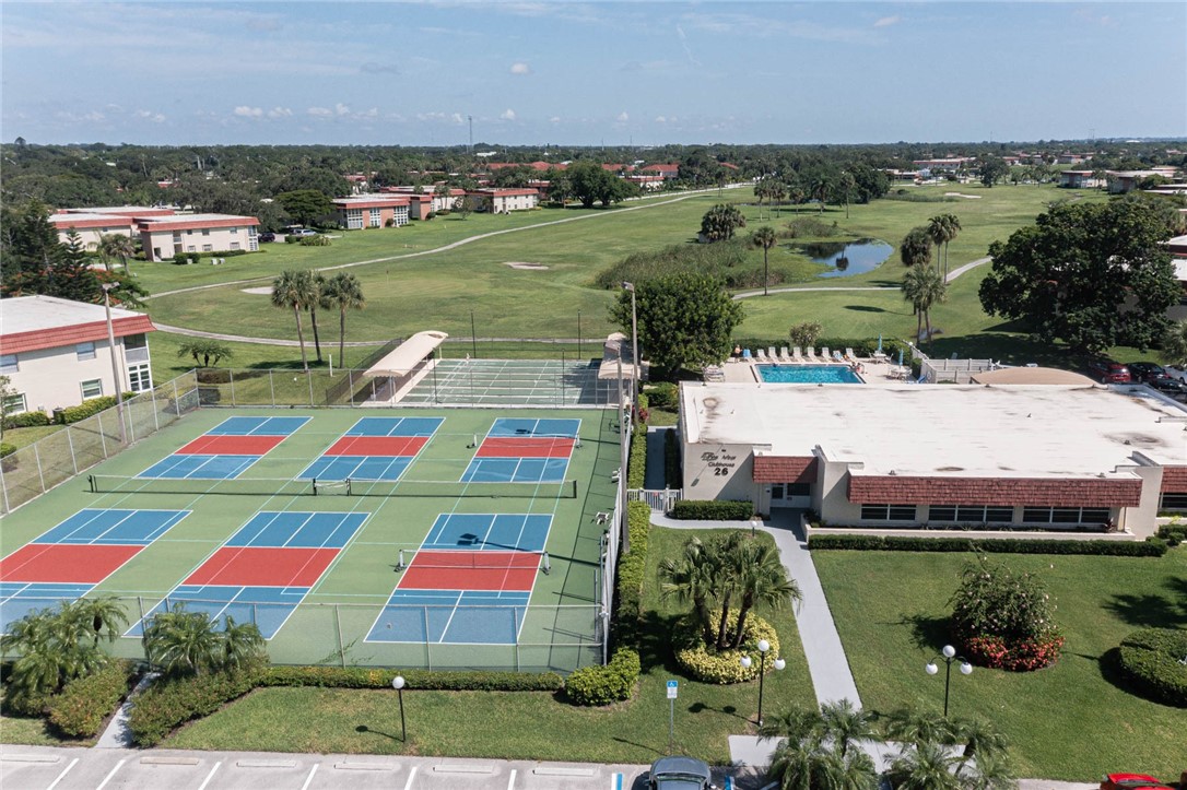 20 Pine Arbor Lane, Unit 202 Vero Beach, FL 32962 - Photo 30 of 36 a view of swimming pool and outdoor space