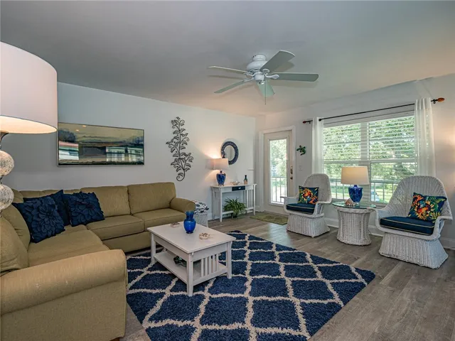 a living room with furniture and a rug