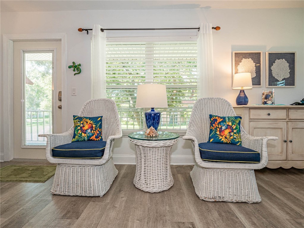 20 Pine Arbor Lane, Unit 202 Vero Beach, FL 32962 - Photo 7 of 36 a living room with furniture and a window