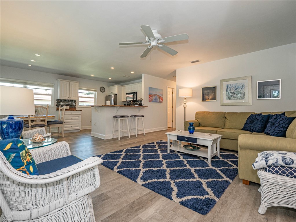 20 Pine Arbor Lane, Unit 202 Vero Beach, FL 32962 - Photo 8 of 36 a living room with furniture and a rug