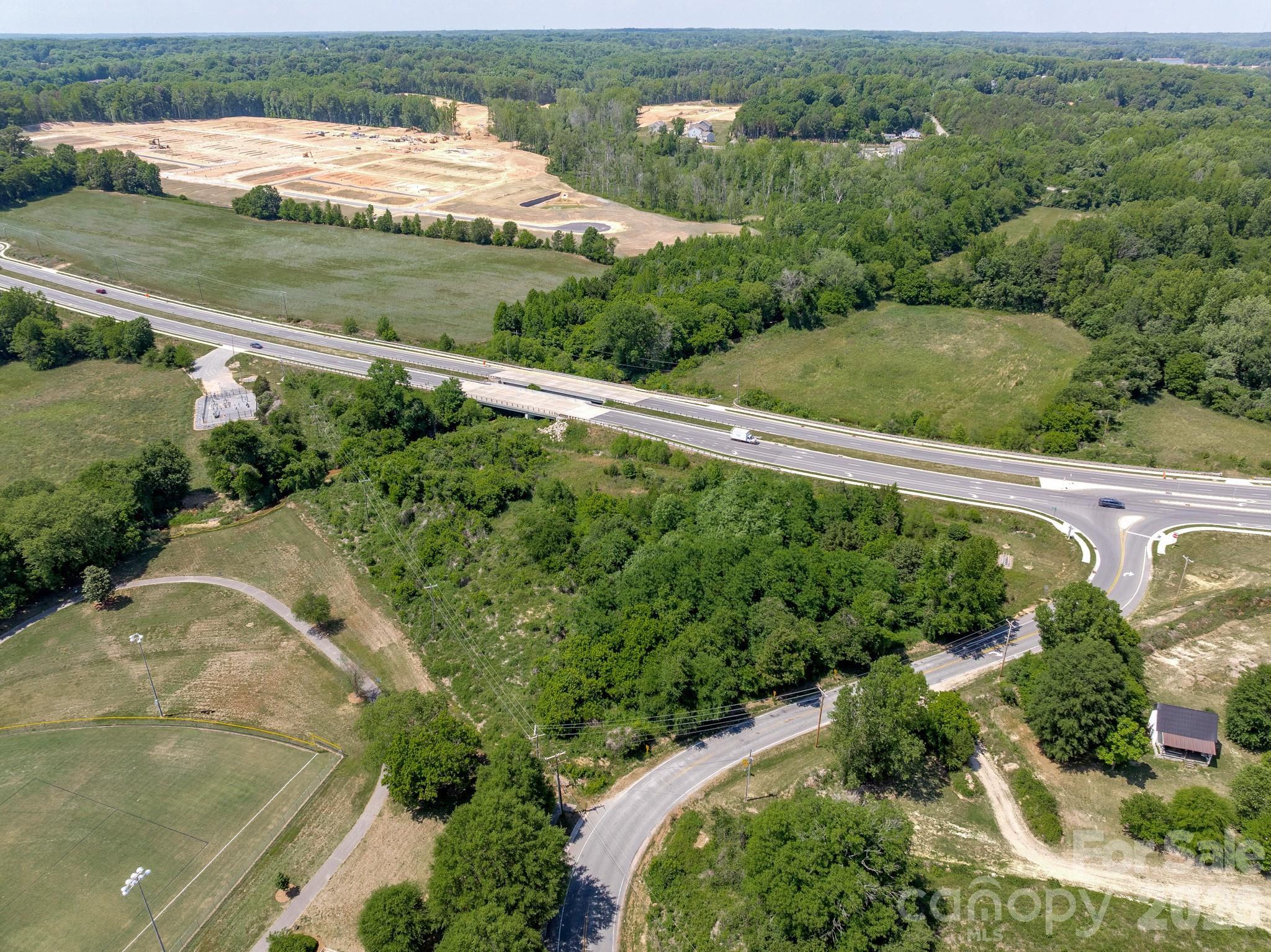1599 Bethpage Road Kannapolis, NC 28081 - Photo 2 of 13 an aerial view of a golf course with a lake view