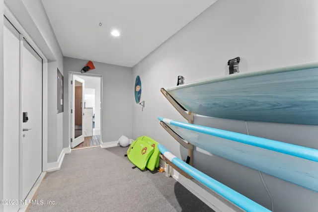 a view of a swimming pool and lounge chairs