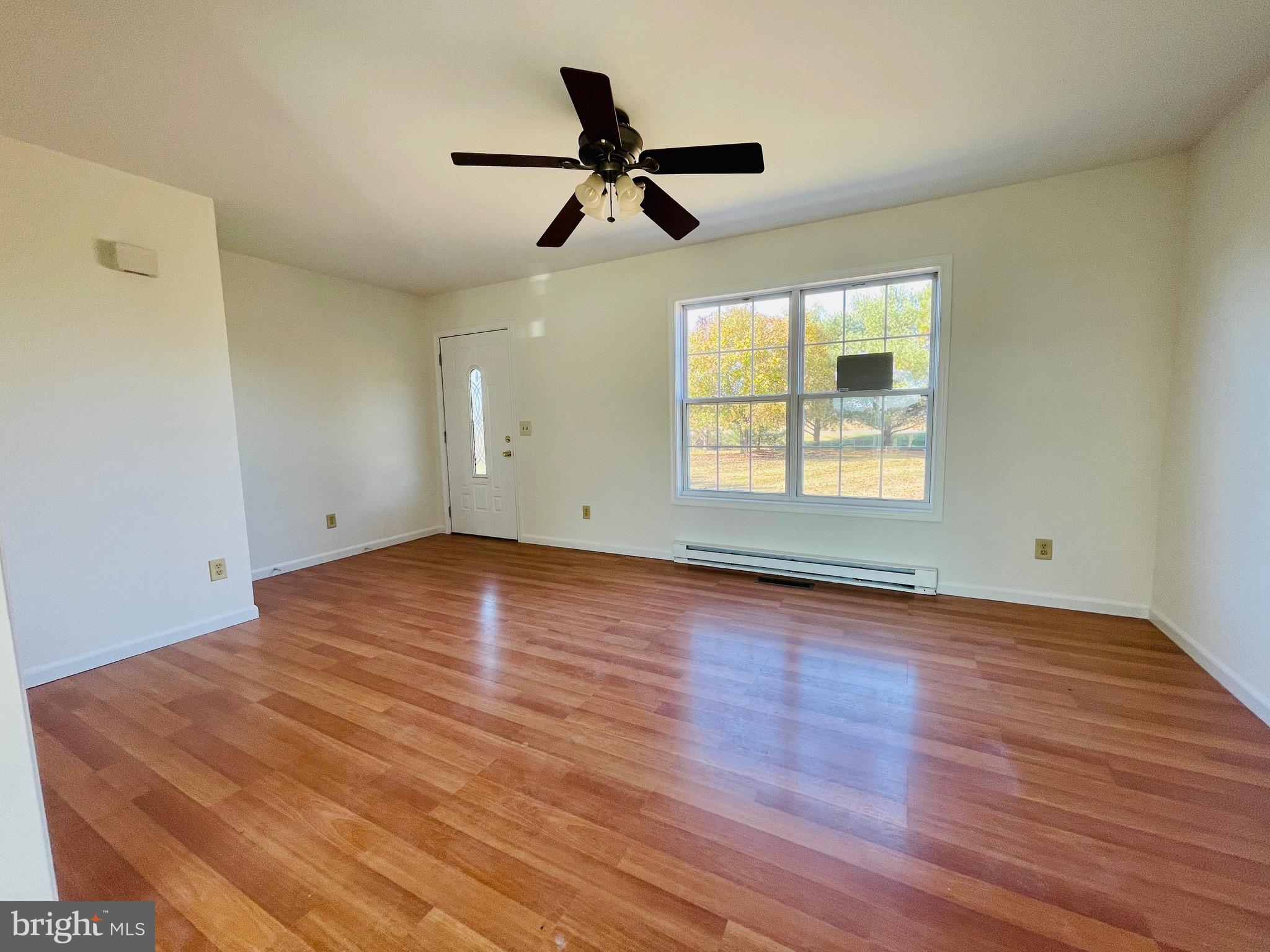 5707 Galestown - Reliance Road Rhodesdale, MD 21659 - Photo 11 of 33 a view of empty room with wooden floor and fan