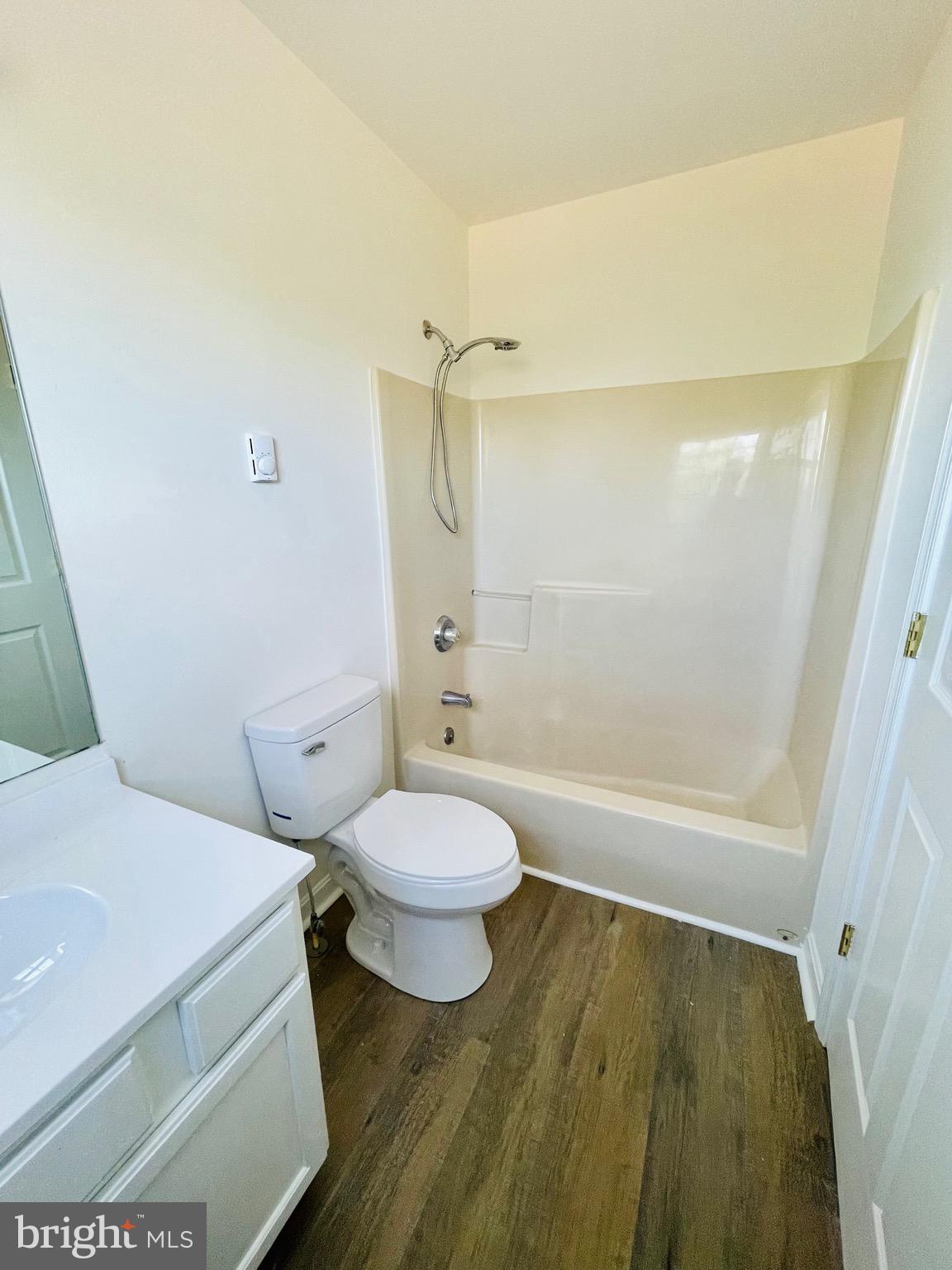 5707 Galestown - Reliance Road Rhodesdale, MD 21659 - Photo 14 of 33 a bathroom with a granite countertop sink a toilet and shower