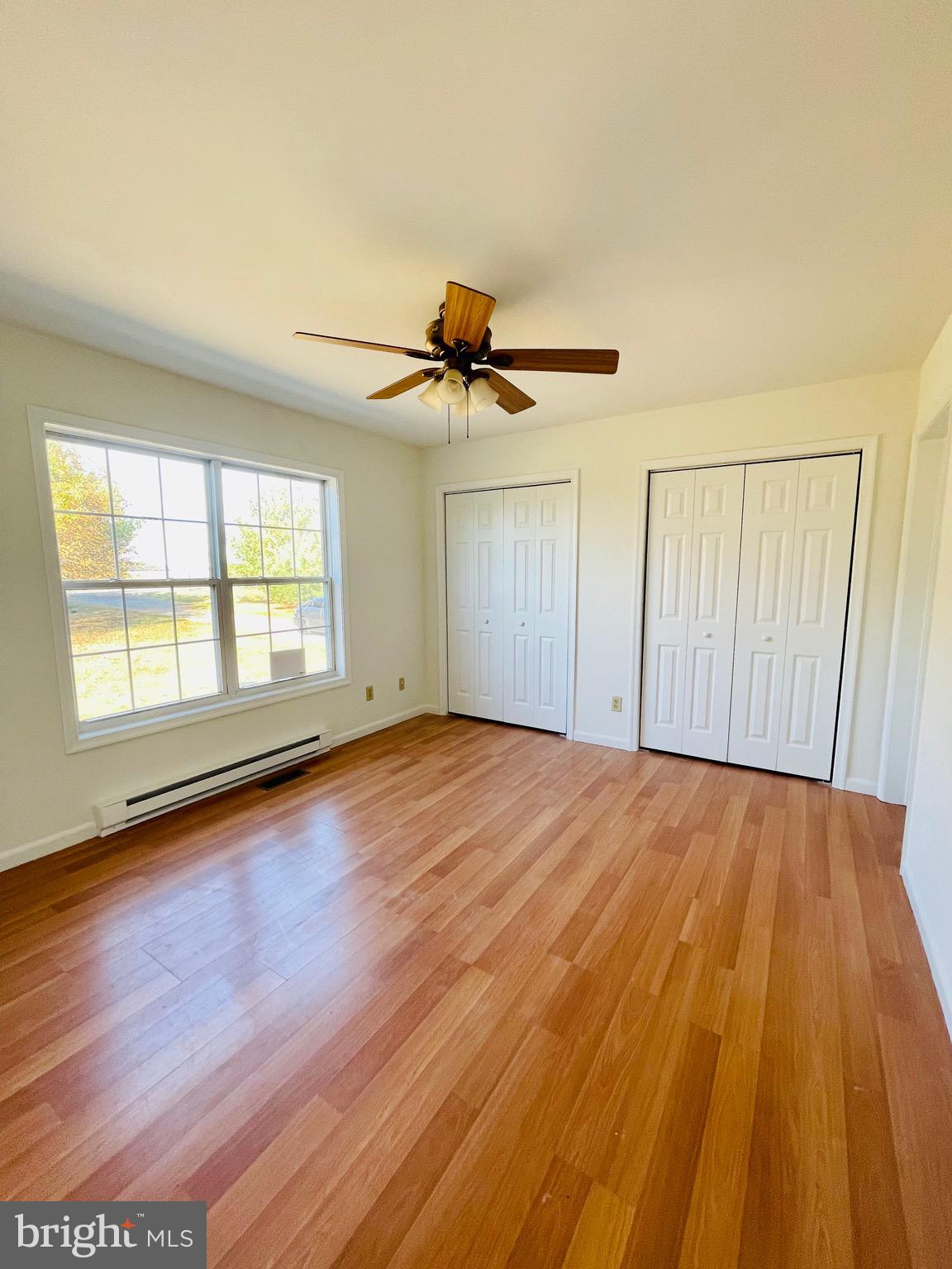 5707 Galestown - Reliance Road Rhodesdale, MD 21659 - Photo 15 of 33 wooden floor in an empty room with a window