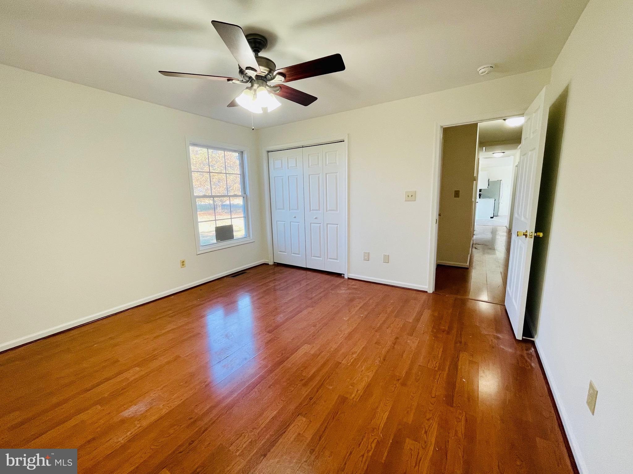 5707 Galestown - Reliance Road Rhodesdale, MD 21659 - Photo 19 of 33 an empty room with wooden floor and windows