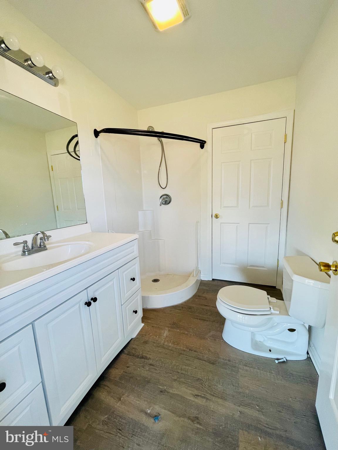 5707 Galestown - Reliance Road Rhodesdale, MD 21659 - Photo 33 of 33 a spacious bathroom with a double vanity sink toilet mirror and shower