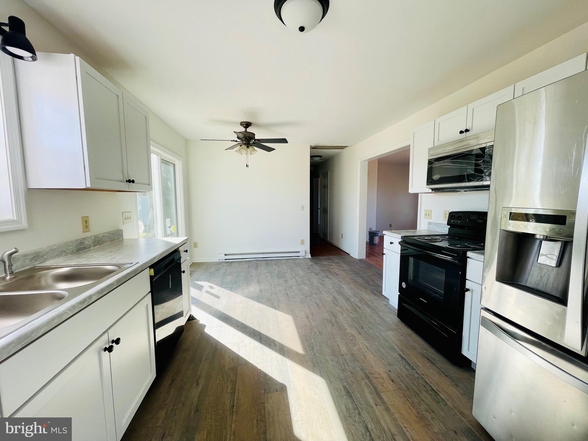 5707 Galestown - Reliance Road Rhodesdale, MD 21659 - Photo 8 of 33 a kitchen with a sink appliances and cabinets