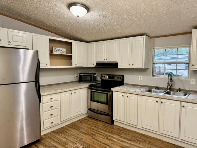 385 V C Pk Road Marble, NC 28905 - Photo 10 of 19 a kitchen with white cabinets and white appliances