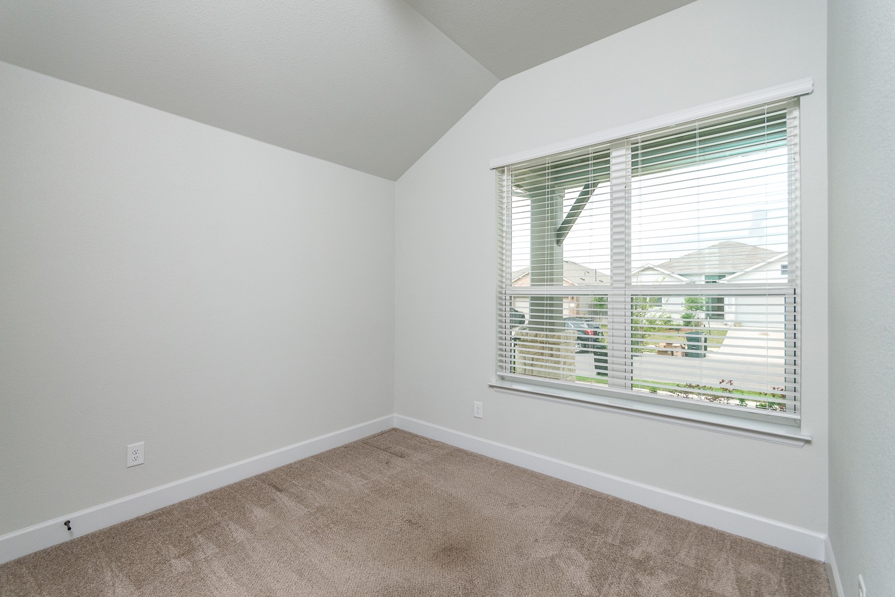 527 Bridgestone Way Buda, TX 78610 - Photo 13 of 21 a room that has a window in it