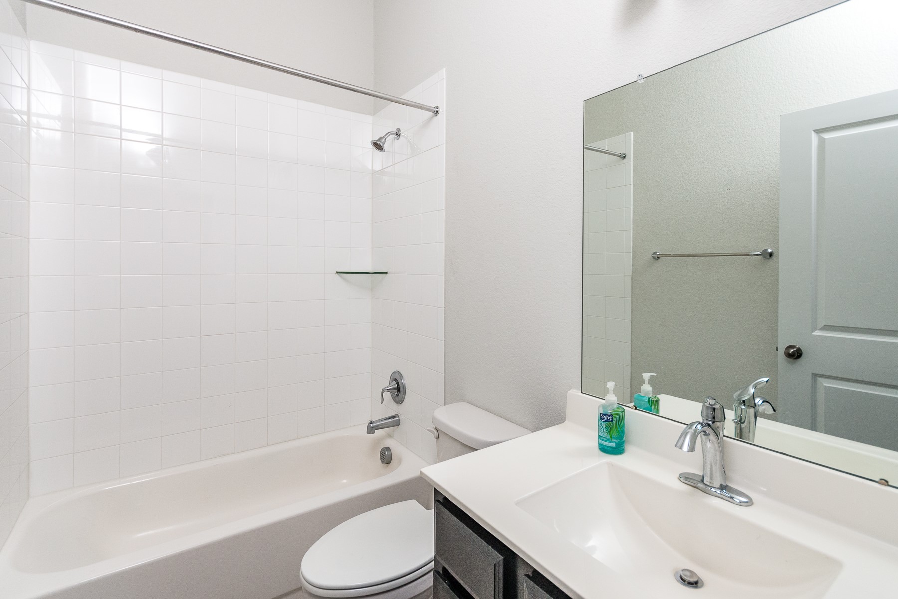 527 Bridgestone Way Buda, TX 78610 - Photo 18 of 21 a bathroom with a sink toilet and shower