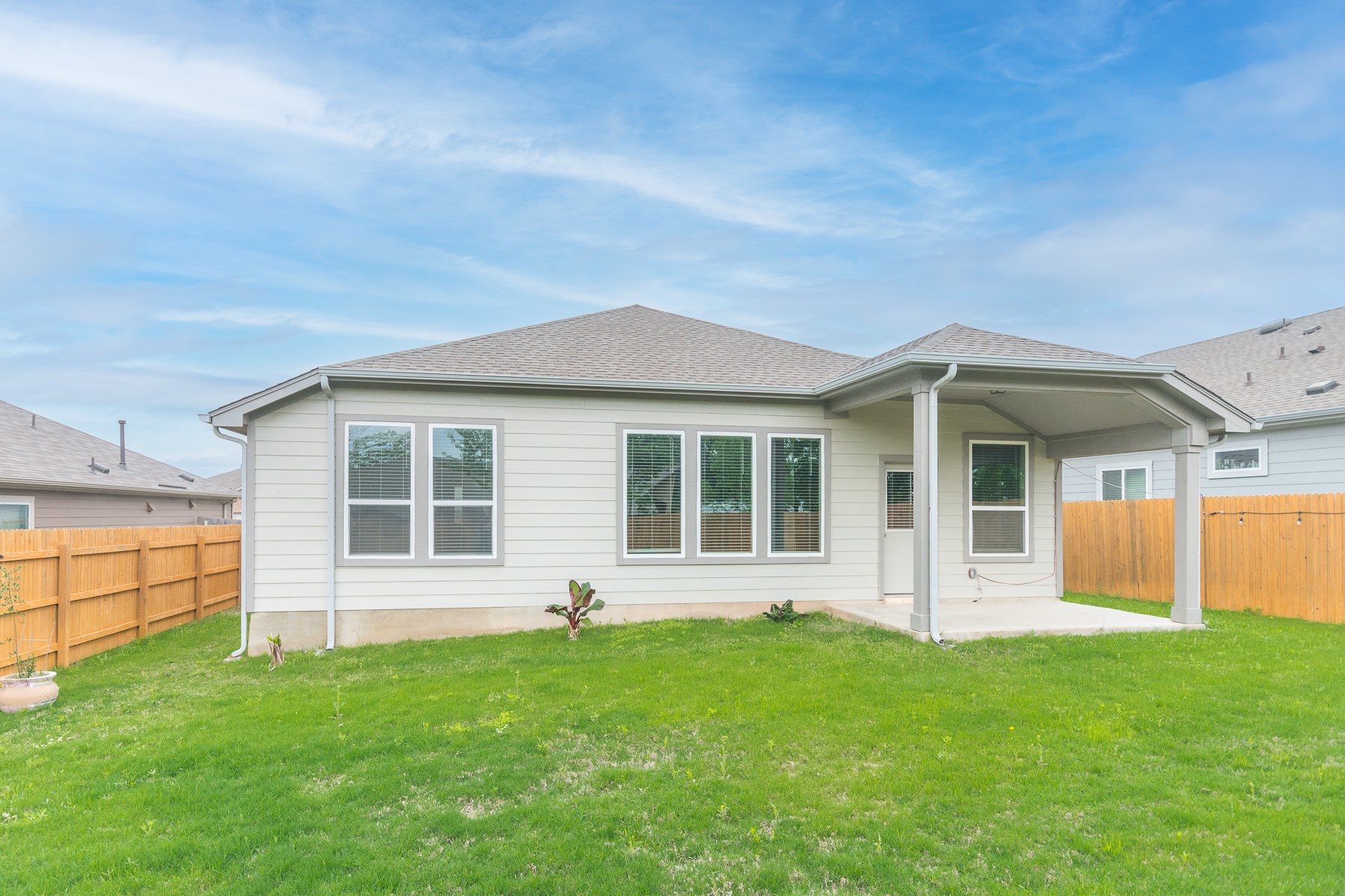 527 Bridgestone Way Buda, TX 78610 - Photo 20 of 21 front view of a house with a yard