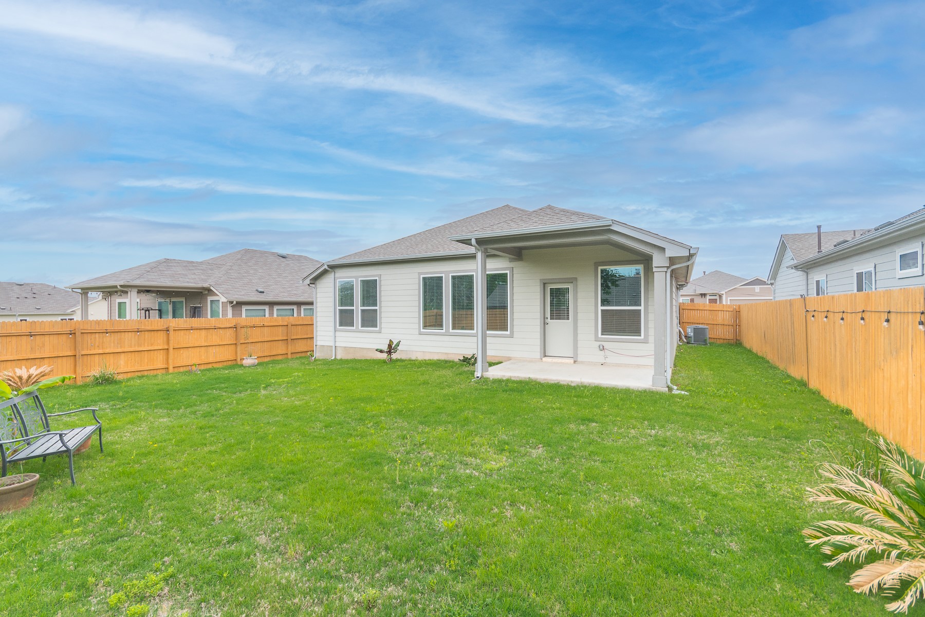 527 Bridgestone Way Buda, TX 78610 - Photo 21 of 21 a front view of a house with a garden