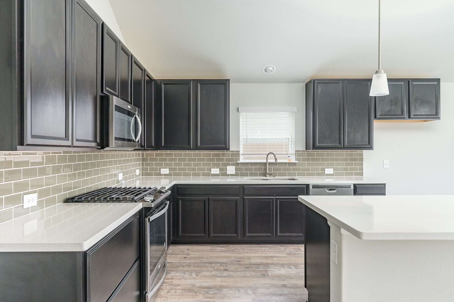 527 Bridgestone Way Buda, TX 78610 - Photo 6 of 21 a kitchen with a sink and cabinets