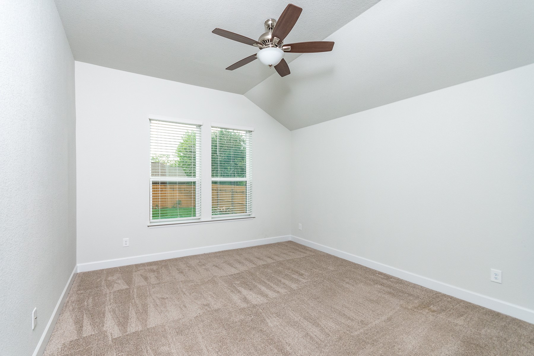 527 Bridgestone Way Buda, TX 78610 - Photo 10 of 21 an empty room with a window and a fan