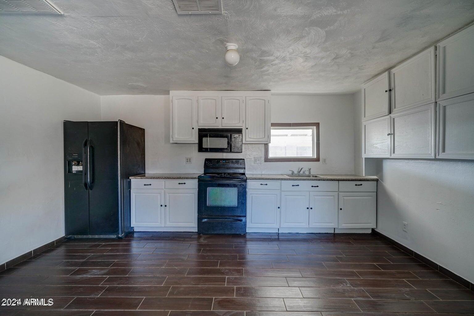 753 West Riverside Street Phoenix, AZ 85041 - Photo 12 of 14 BACK HOUSE KITCHEN