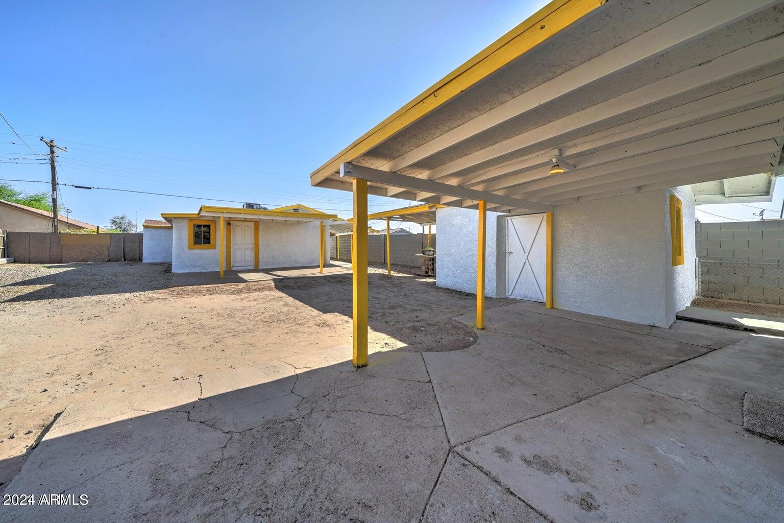 753 West Riverside Street Phoenix, AZ 85041 - Photo 7 of 14 PATIO AND BACK HOUSE
