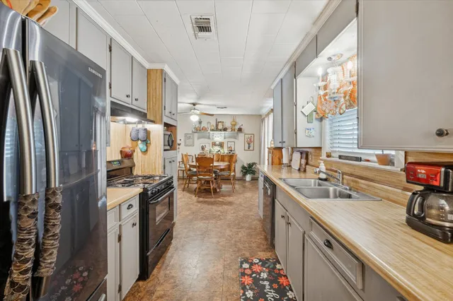 a kitchen with lots of counter top space and appliances