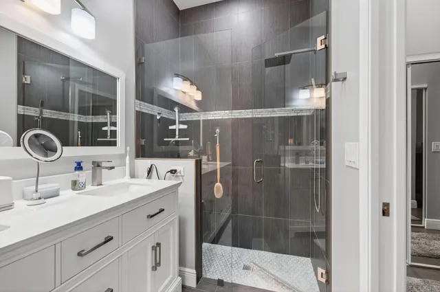 a bedroom with bed and night stand