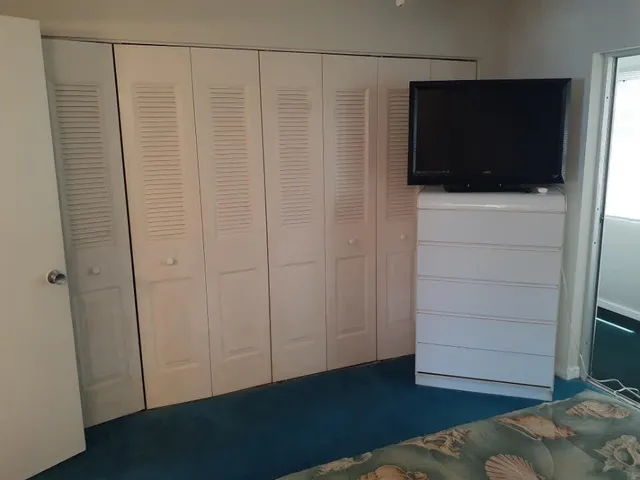 a view of a livingroom with wooden floor