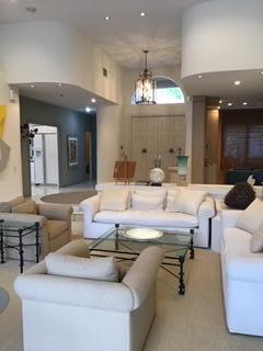 2226 Northwest 60th Street Boca Raton, FL 33496 - Photo 7 of 22 a living room with furniture and a chandelier