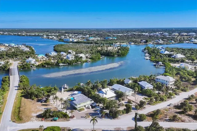 an aerial view of a house with a lake view
