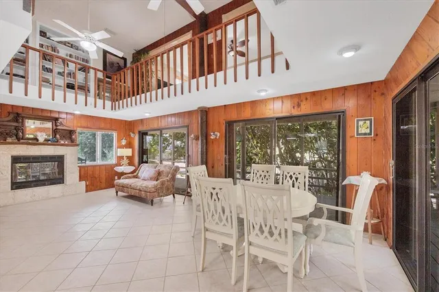 a dining room with furniture fire place and a fireplace