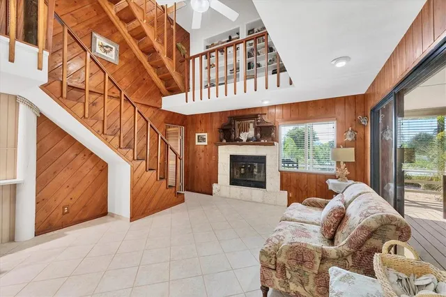 a view of a livingroom with furniture and staircase