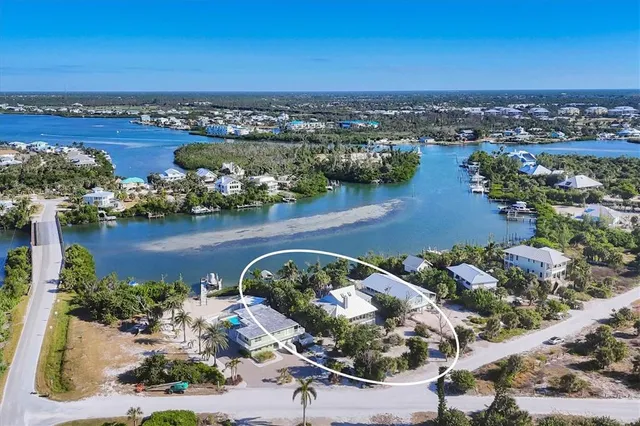 an aerial view of a house with a lake view