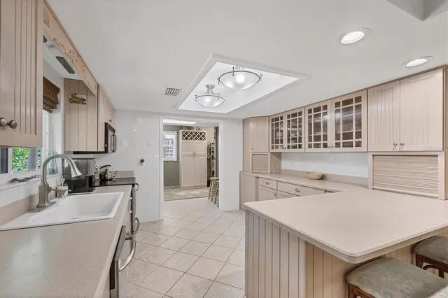 a kitchen that has a cabinets and a stove