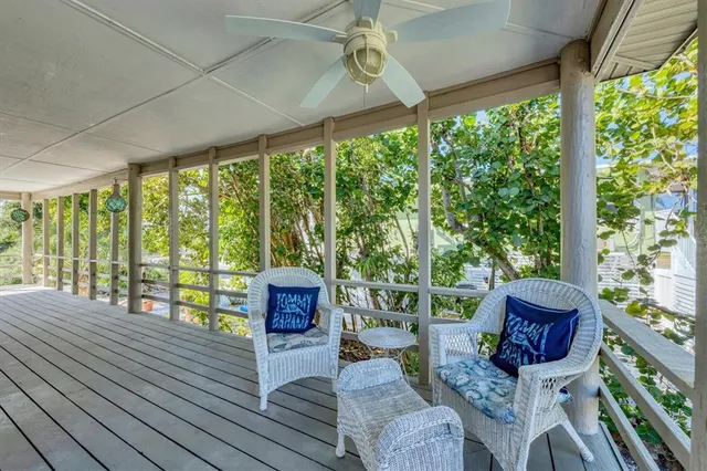 a kitchen with a refrigerator and white cabinets