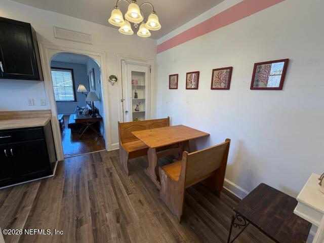 2670 Post Street, Unit 3 Jacksonville, FL 32204 - Photo 12 of 21 a view of a dining room with furniture and wooden floor