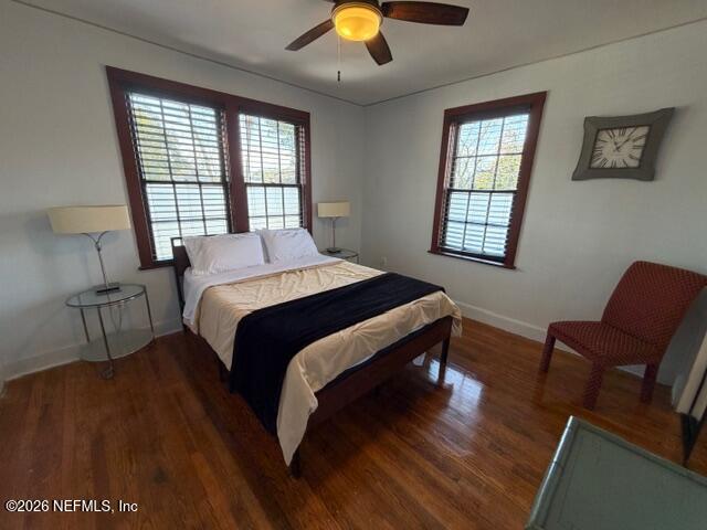 2670 Post Street, Unit 3 Jacksonville, FL 32204 - Photo 14 of 21 a bedroom with a bed and a chandelier